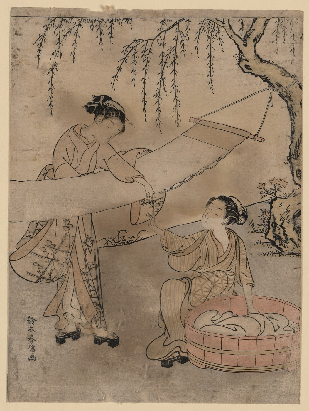 洗い張りの図。解いた反物を板に張って乾かしている