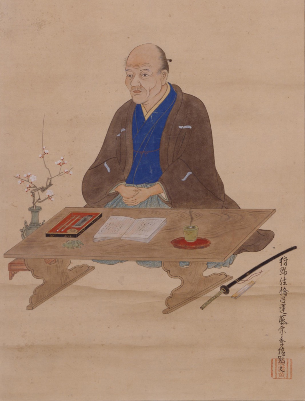 文机に向かい書物を開く貝原益軒の肖像画